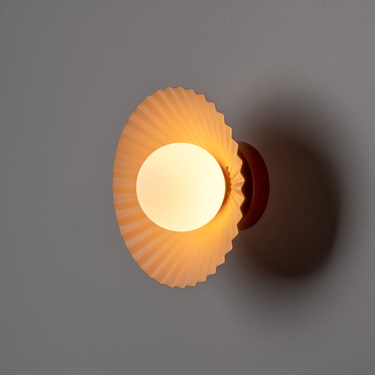 Burnt orange flush pleat wall light