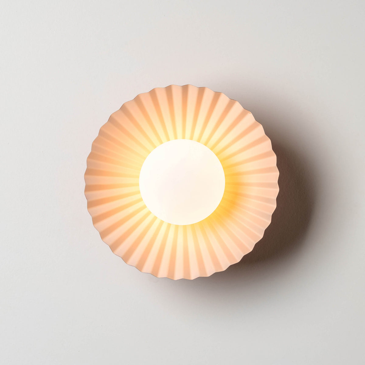 Burnt orange flush pleat wall light