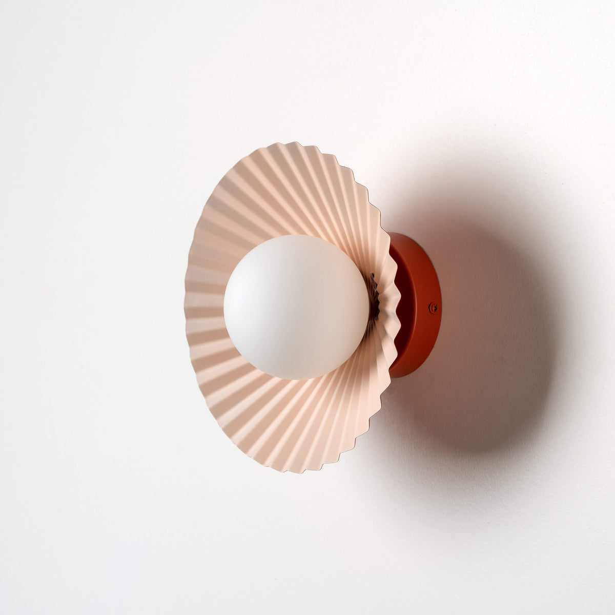 Burnt orange flush pleat wall light